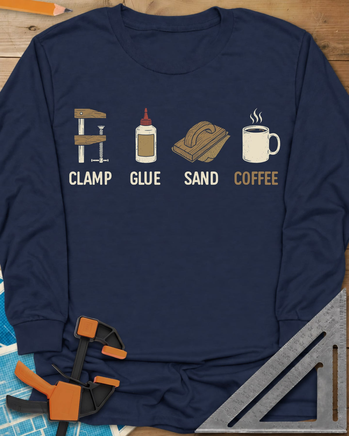 Woodworker's Essentials long sleeve shirt in Navy, a bar clamp, glue bottle, sanding block and mug, each captioned