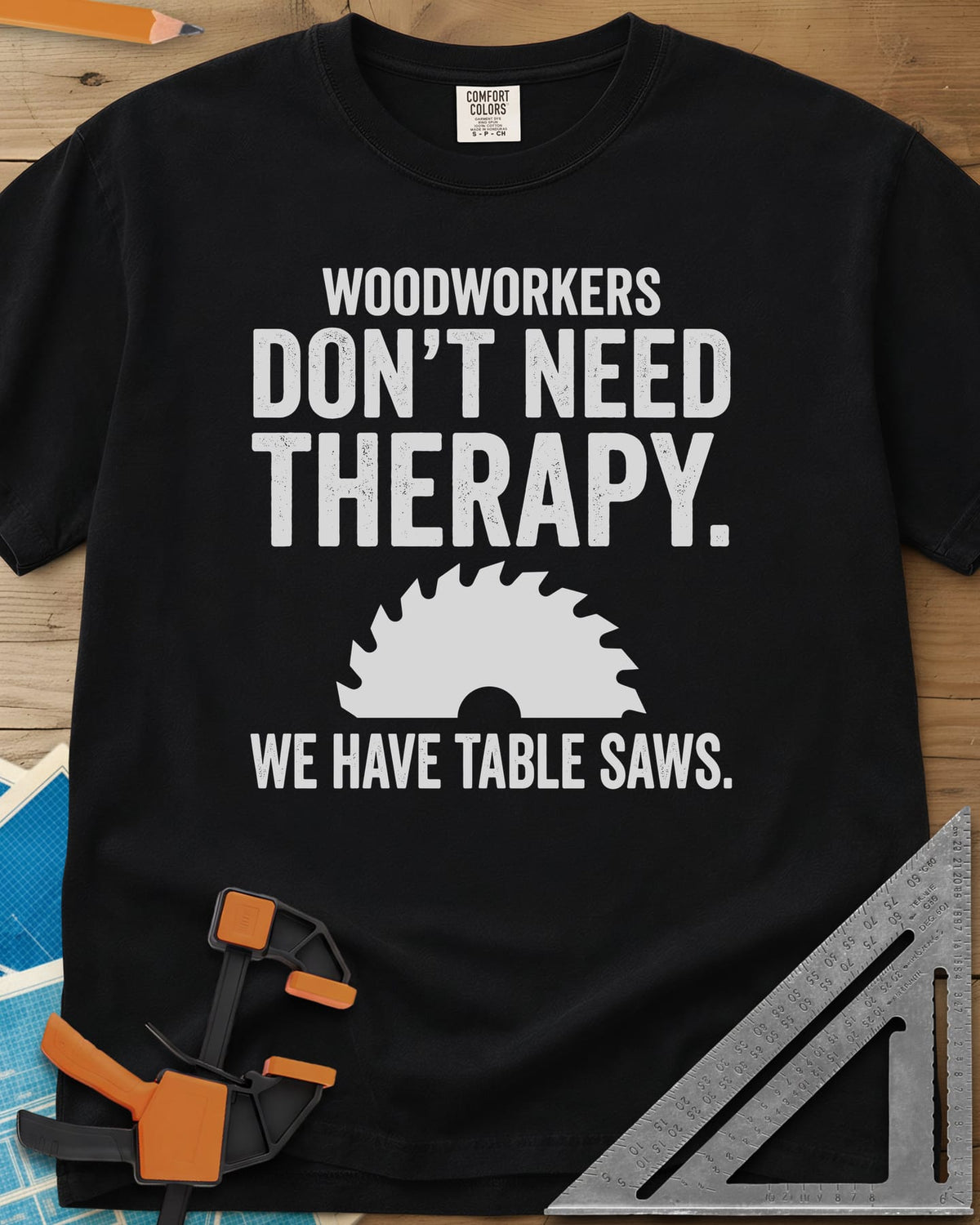 Woodworkers Have Table Saws heavyweight tee in Black, bold lettering above and below a round saw blade