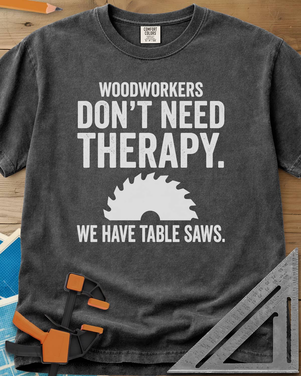Woodworkers Have Table Saws heavyweight tee in Pepper, bold lettering above and below a round saw blade