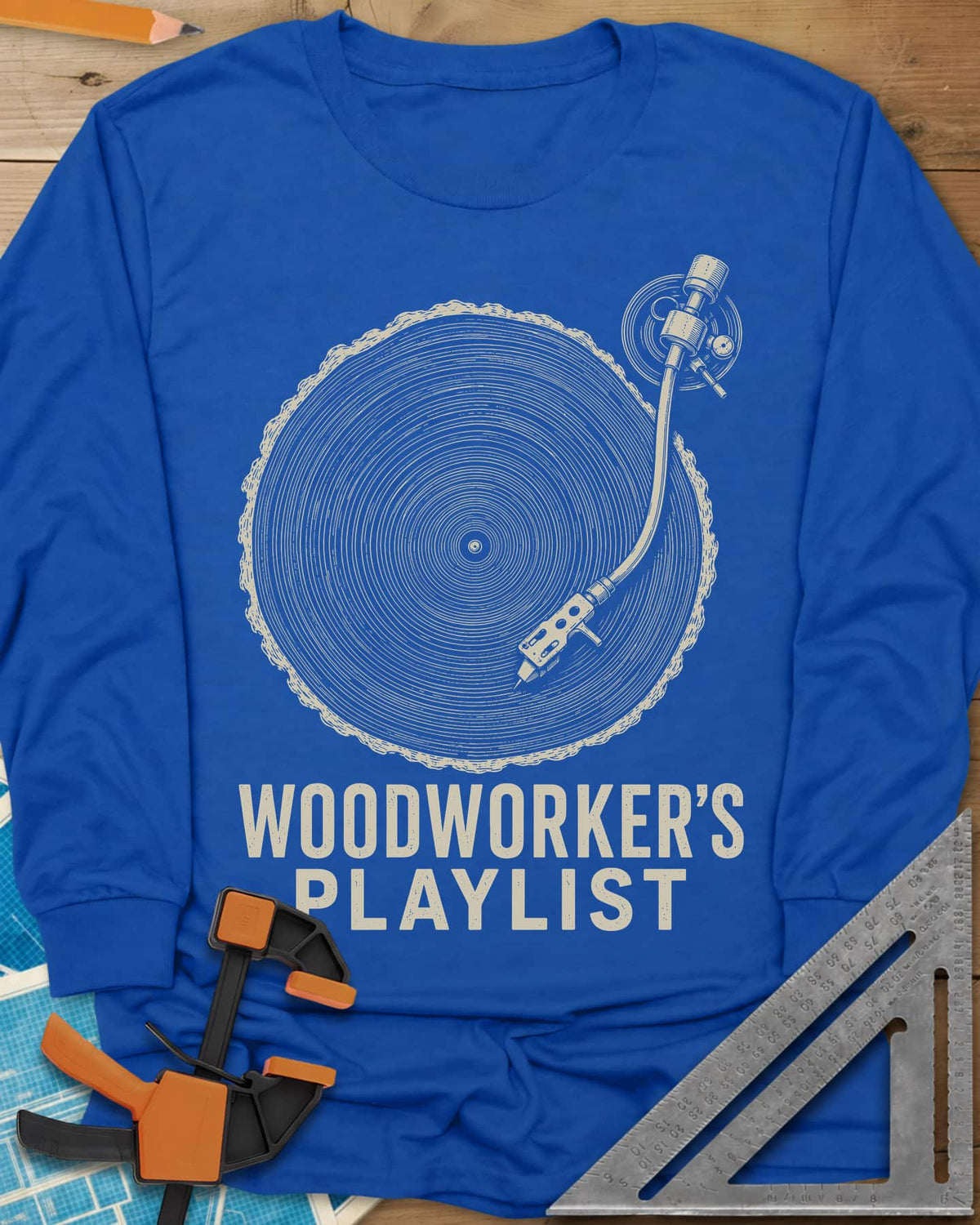 Woodworker’s Playlist long sleeve shirt in Royal, tree-ring slice as a vinyl record with a turntable tonearm