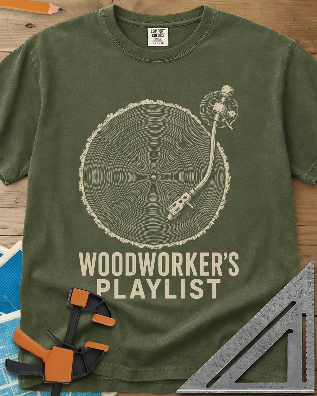 Woodworker’s Playlist heavyweight tee in Hemp, tree-ring slice as a vinyl record with a turntable tonearm
