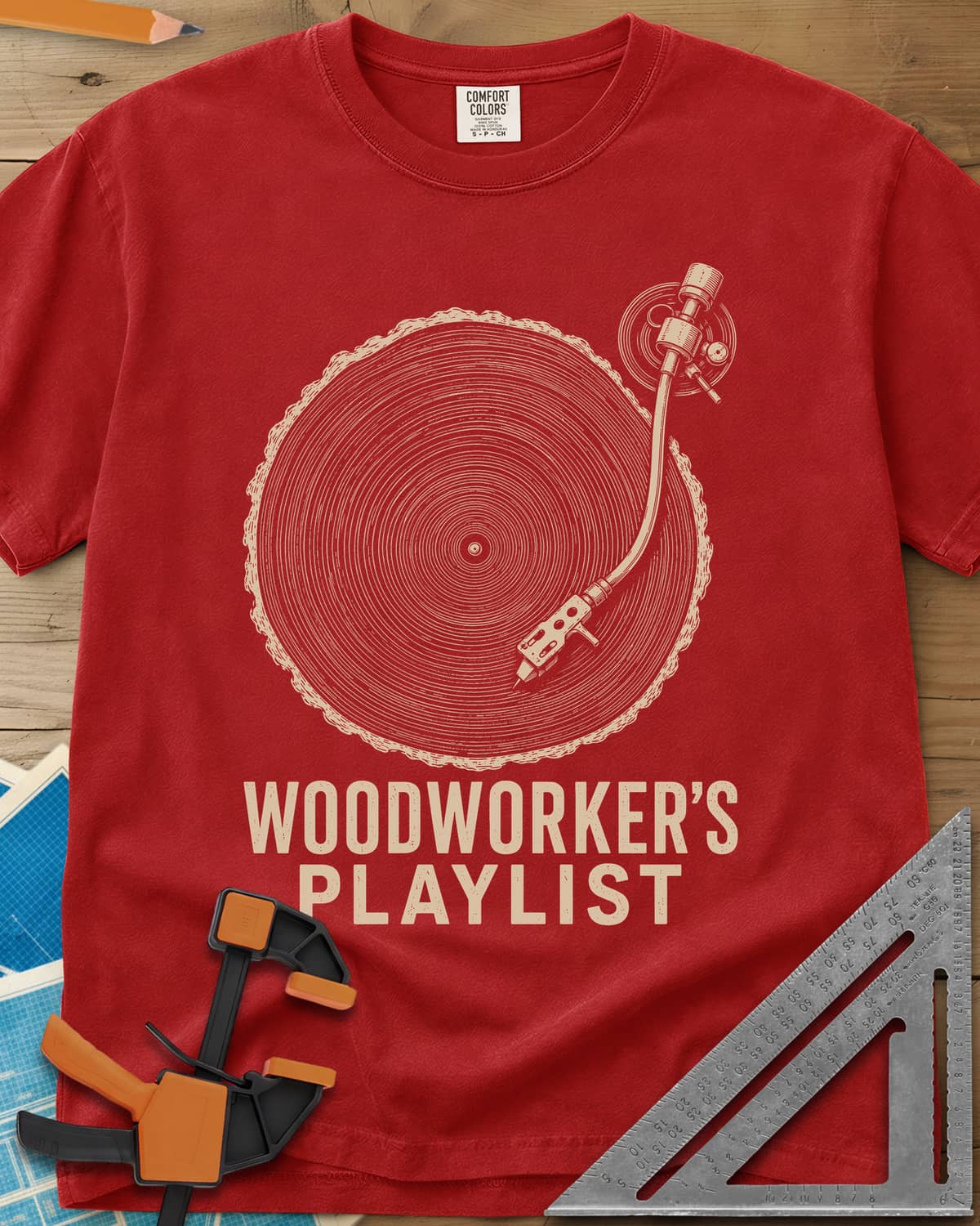 Woodworker’s Playlist heavyweight tee in Red, tree-ring slice as a vinyl record with a turntable tonearm
