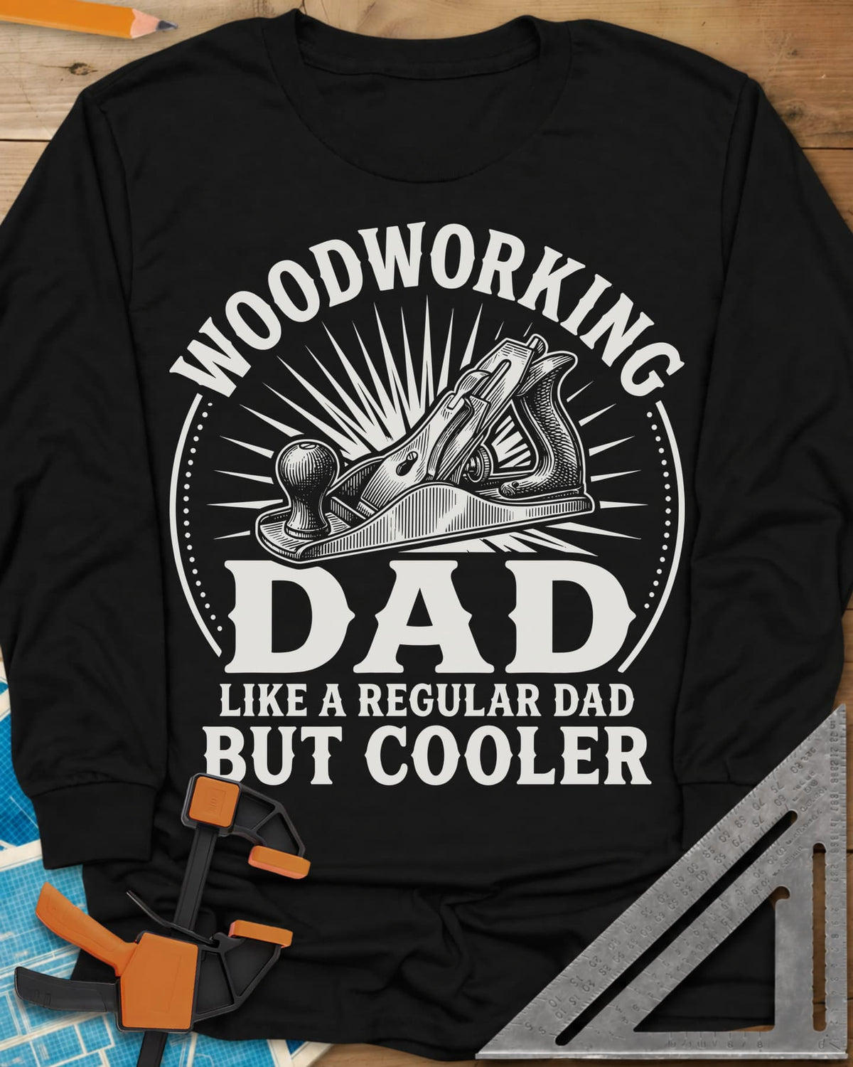 Woodworking Dad But Cooler long sleeve shirt in Black, an engraved hand plane in a sunburst circle