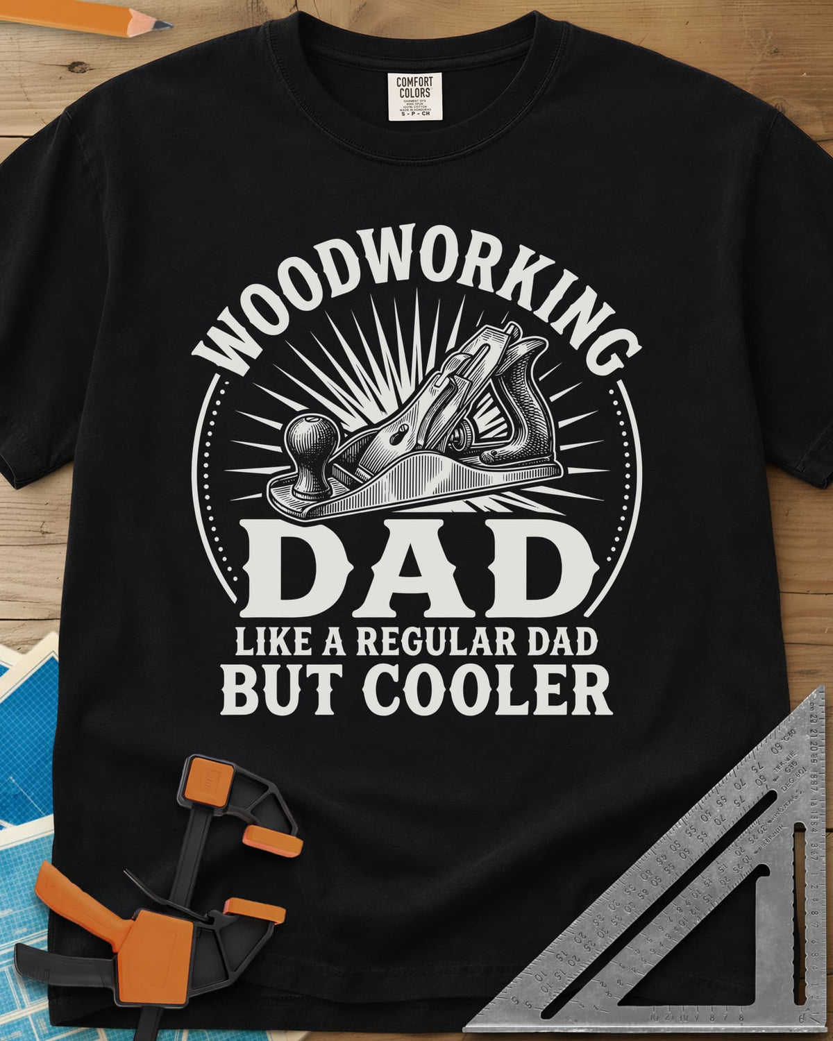 Woodworking Dad But Cooler heavyweight tee in Black, an engraved hand plane in a sunburst circle