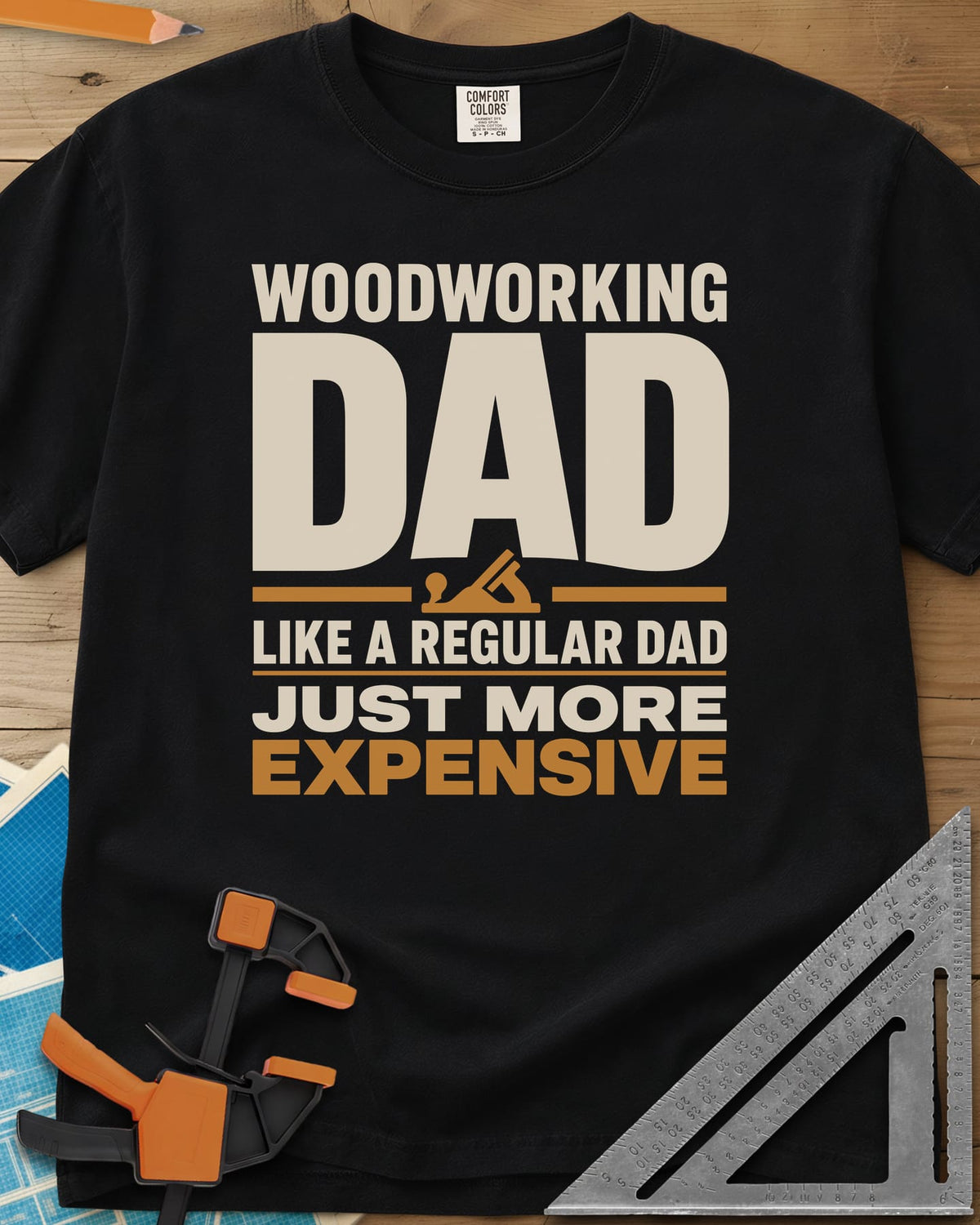 Woodworking Dad Just More Expensive heavyweight tee in Black, bold lettering with a small hand plane tucked under DAD