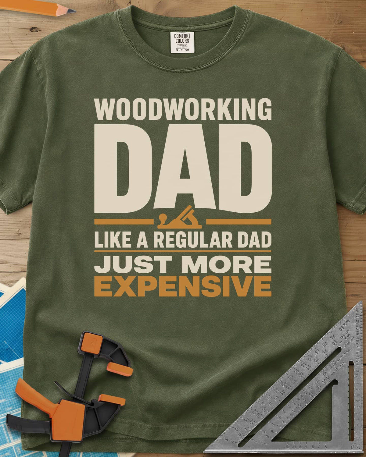 Woodworking Dad Just More Expensive heavyweight tee in Hemp, bold lettering with a small hand plane tucked under DAD