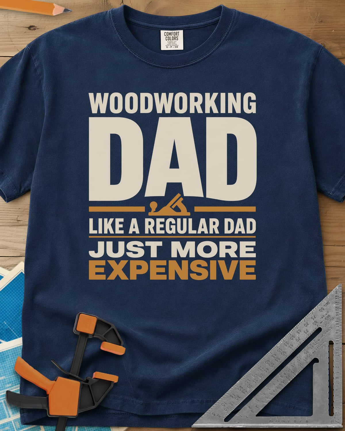Woodworking Dad Just More Expensive heavyweight tee in Navy, bold lettering with a small hand plane tucked under DAD