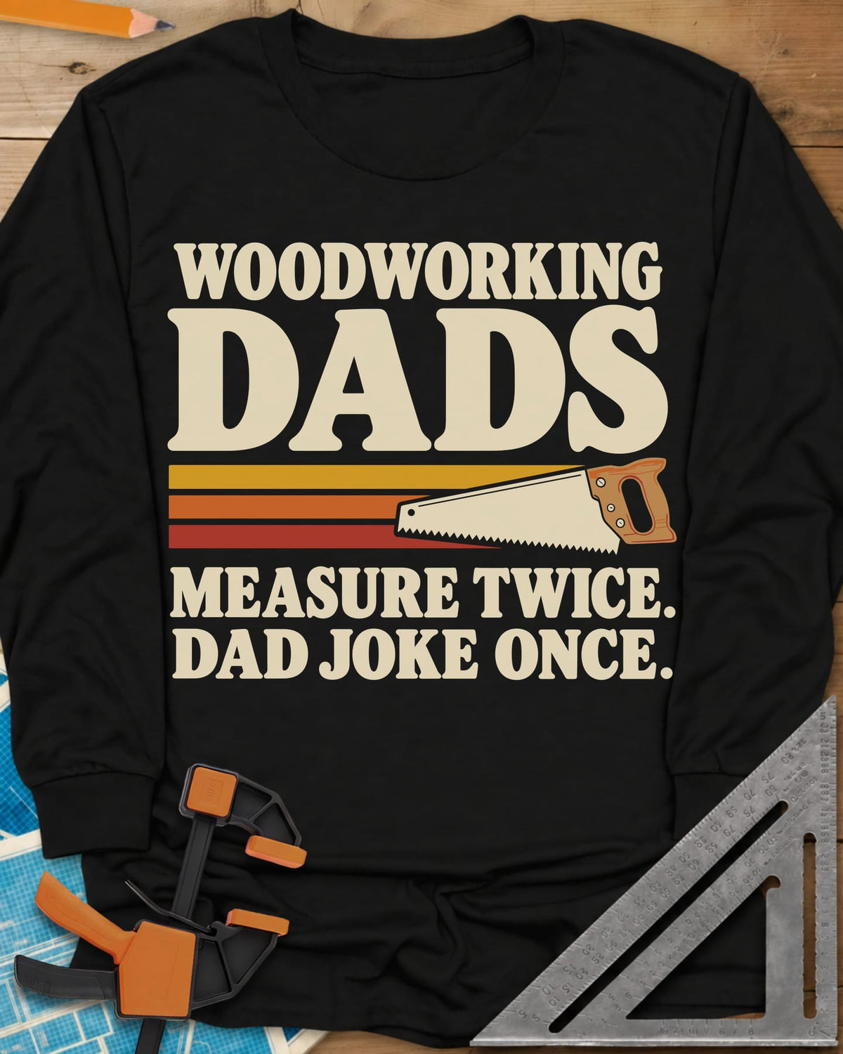 Woodworking Dads long sleeve shirt in Black, retro stripes trailing a hand saw under bold type
