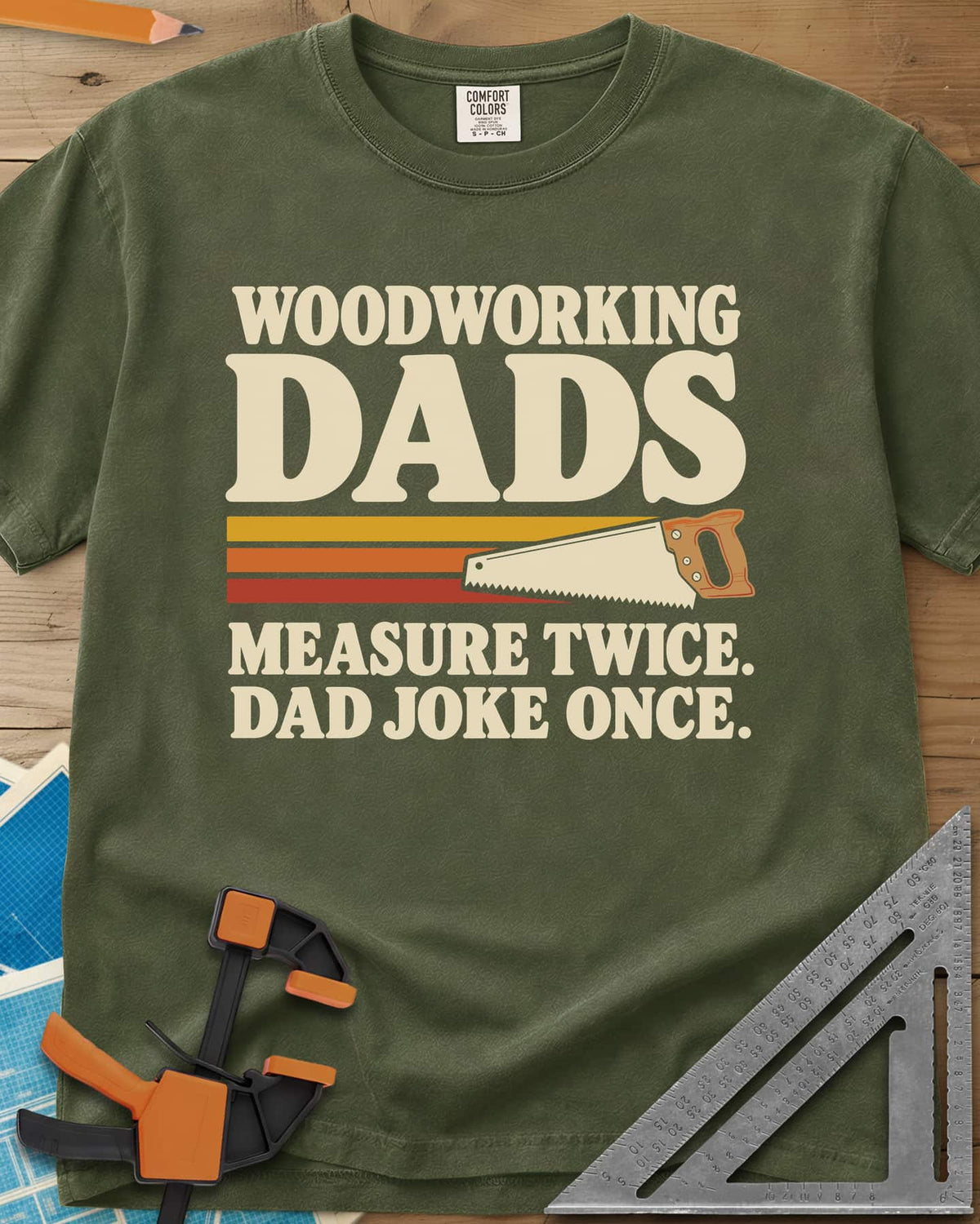 Woodworking Dads heavyweight tee in Hemp, retro stripes trailing a hand saw under bold type