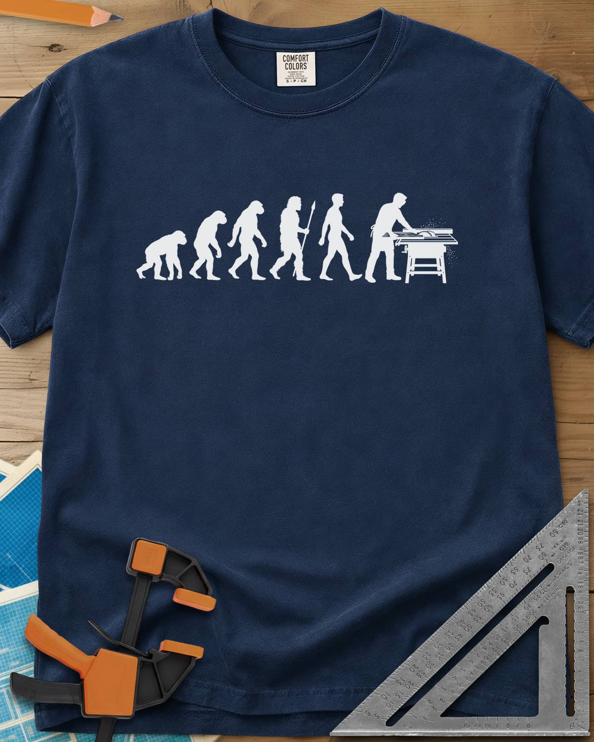Woodworking Evolution heavyweight tee in Navy, six white silhouettes from an ape to a man at a table saw