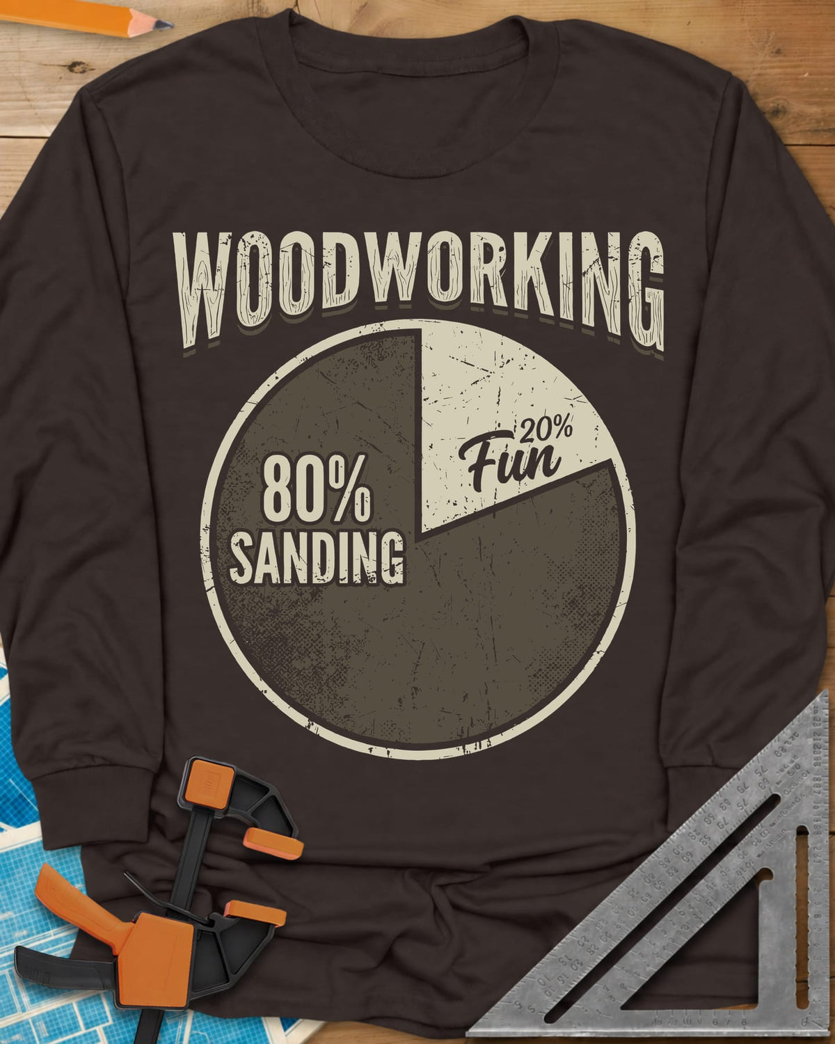Woodworking Fun long sleeve shirt in Dark Chocolate, a worn pie chart split 80% sanding and 20% fun