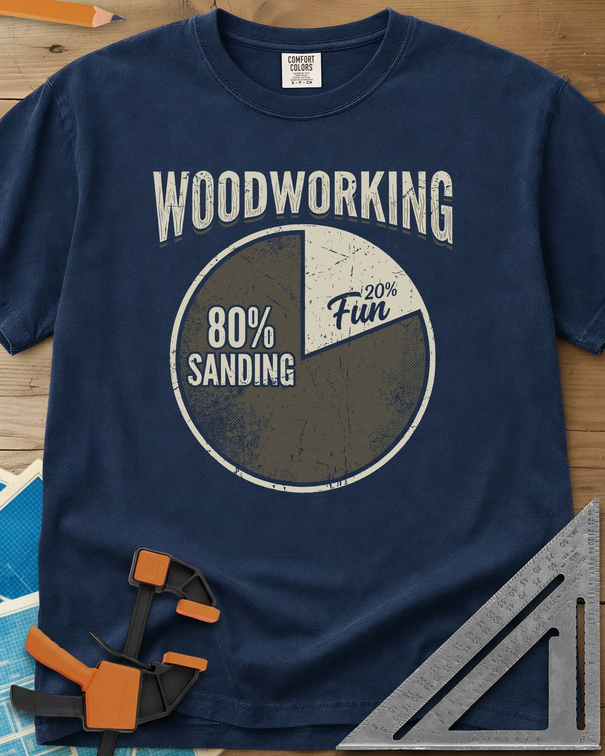 Woodworking Fun heavyweight tee in Navy, a worn pie chart split 80% sanding and 20% fun
