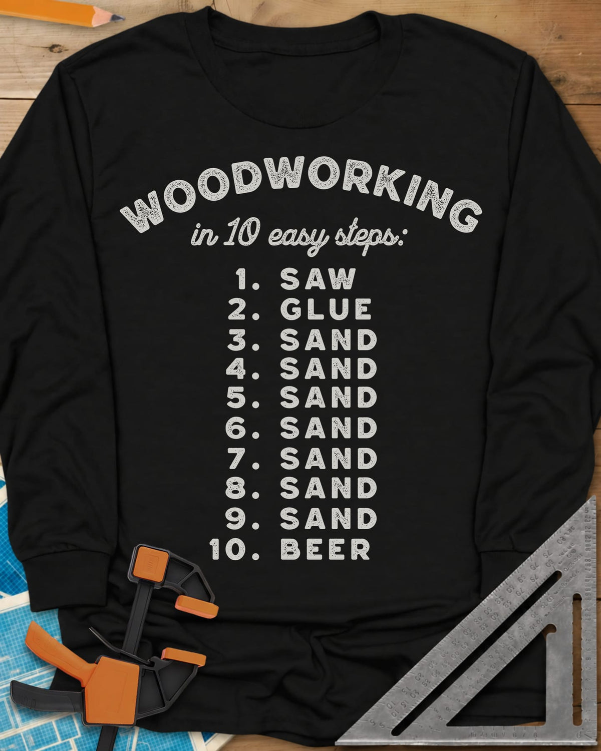 Woodworking in 10 Easy Steps long sleeve shirt in Black, a numbered list: saw, glue, sand seven times, then beer
