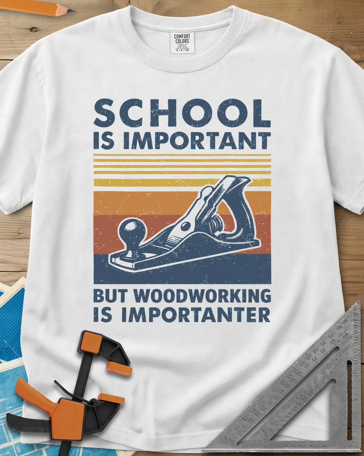 Woodworking is Importanter heavyweight tee in White, a vintage hand plane over retro sunset stripes