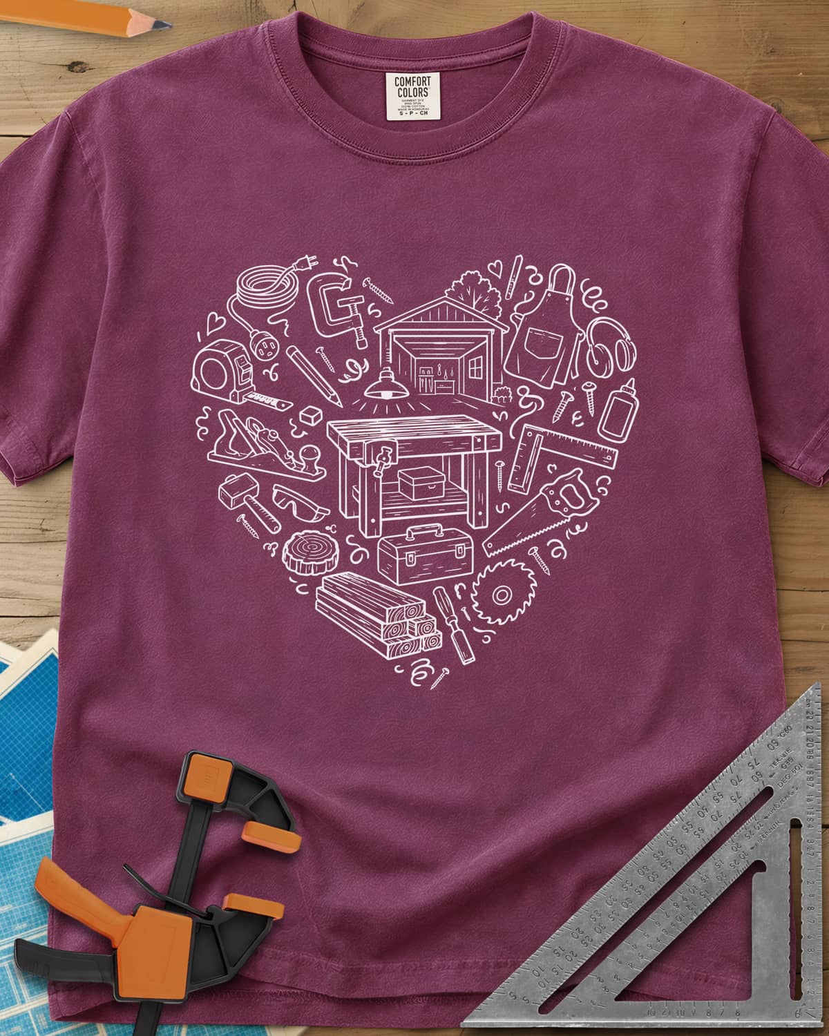Woodworking Is My Happy Place heavyweight tee in Berry, a heart built from tiny shop tools, a workbench and a garage