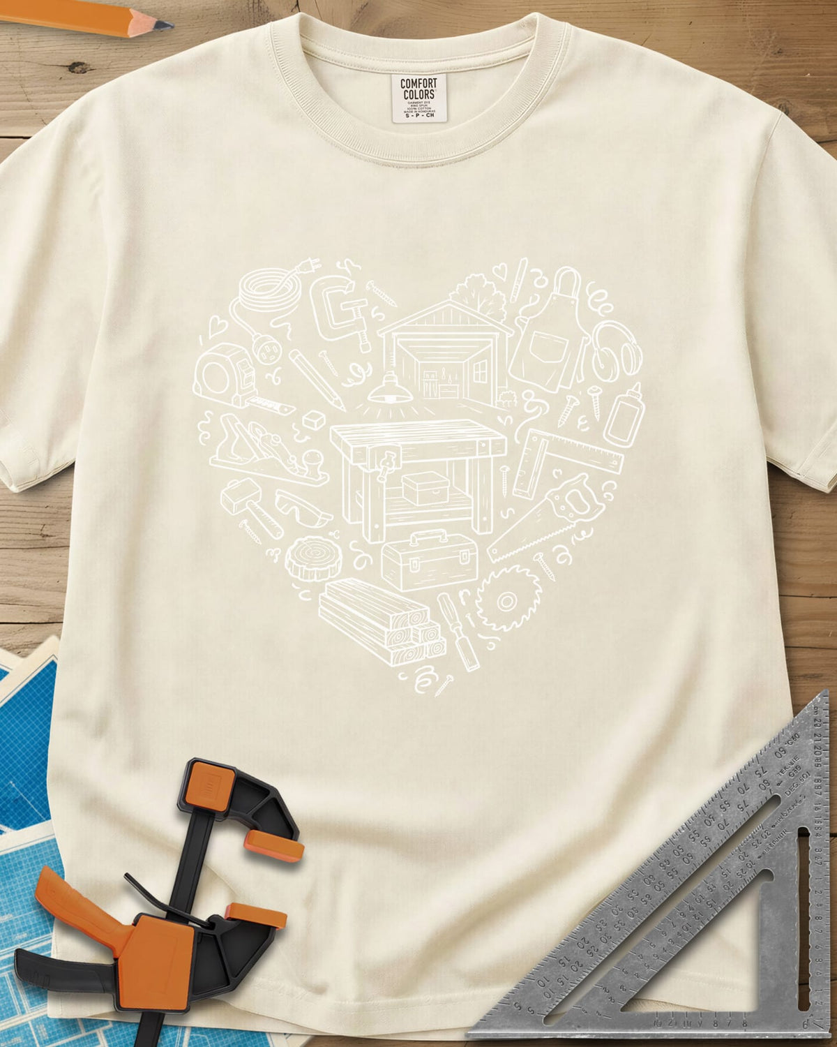 Woodworking Is My Happy Place heavyweight tee in Ivory, a heart built from tiny shop tools, a workbench and a garage