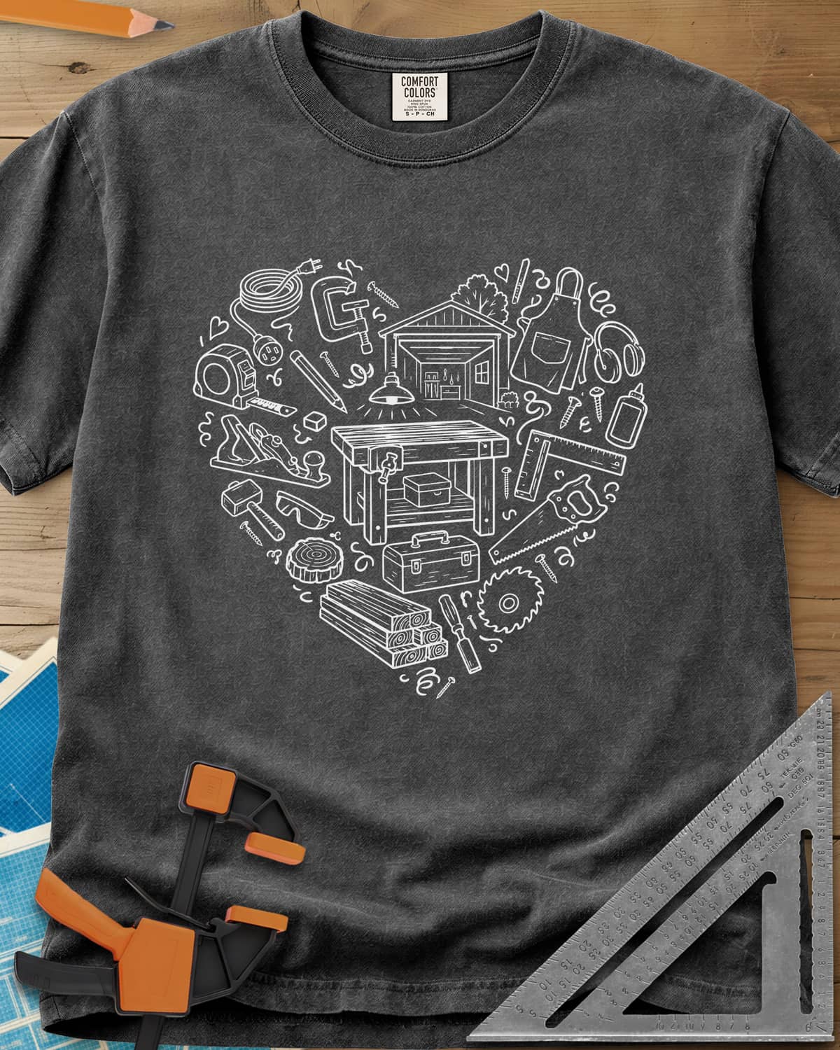 Woodworking Is My Happy Place heavyweight tee in Pepper, a heart built from tiny shop tools, a workbench and a garage