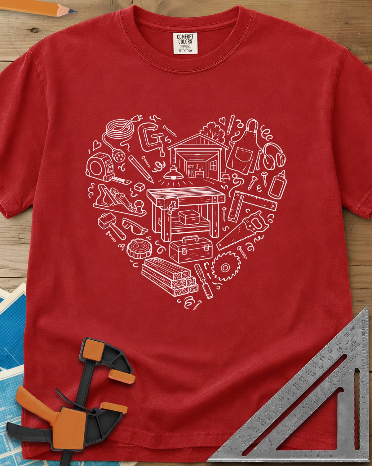 Woodworking Is My Happy Place heavyweight tee in Red, a heart built from tiny shop tools, a workbench and a garage