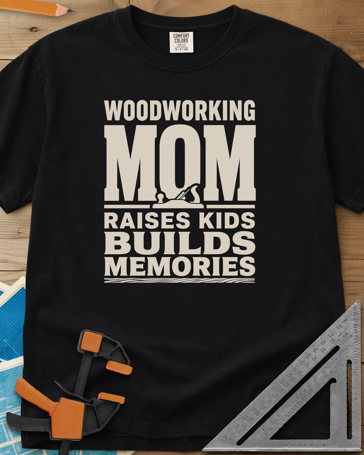 Woodworking Mom Memories heavyweight tee in Black, bold stacked lettering with a hand plane set into the O of MOM
