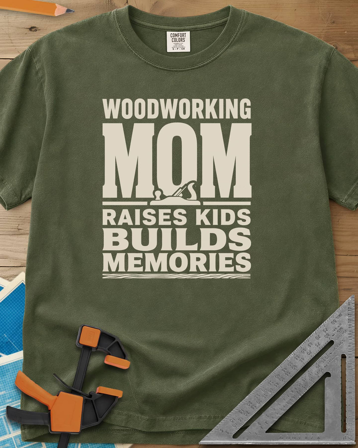Woodworking Mom Memories heavyweight tee in Hemp, bold stacked lettering with a hand plane set into the O of MOM