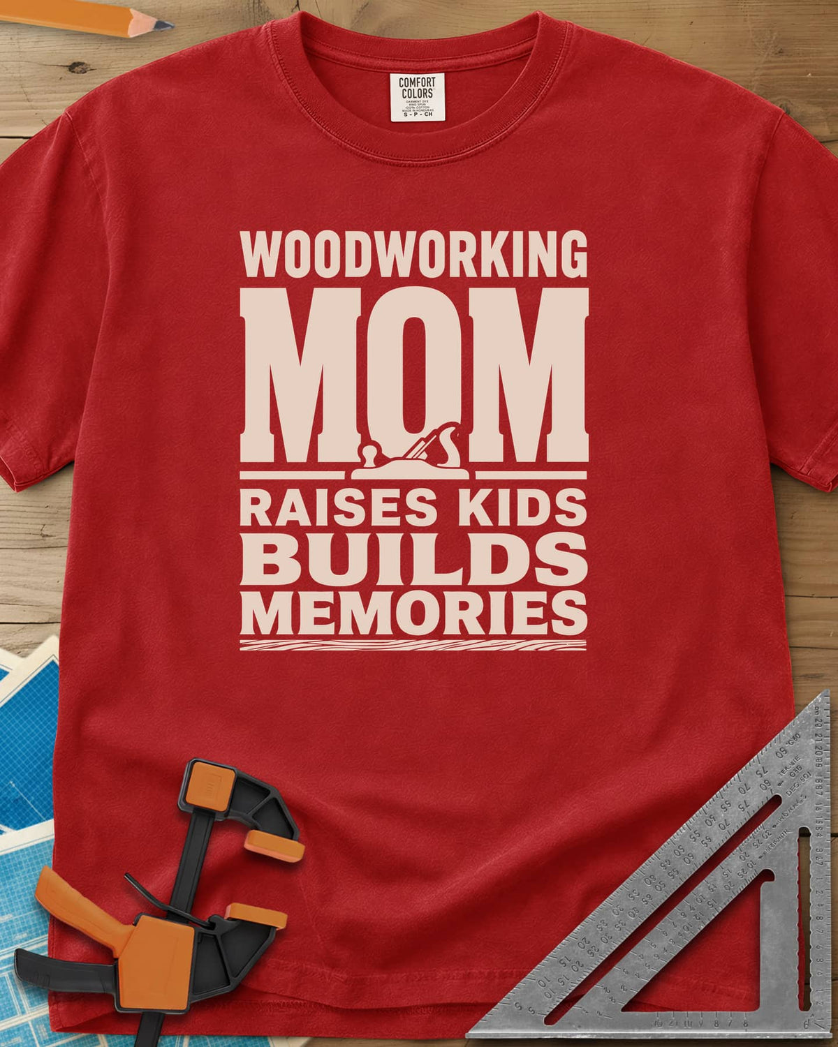 Woodworking Mom Memories heavyweight tee in Red, bold stacked lettering with a hand plane set into the O of MOM