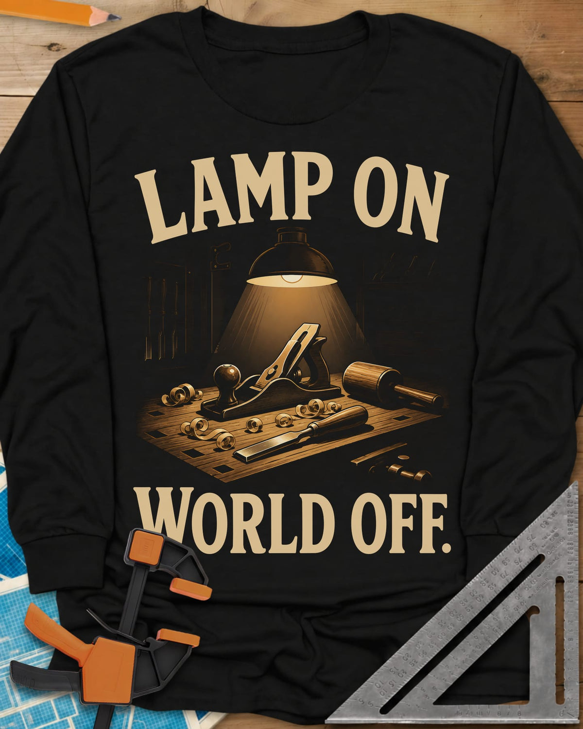 Workbench Lamp long sleeve shirt in Black, a shop lamp over a bench with plane, chisel and shavings