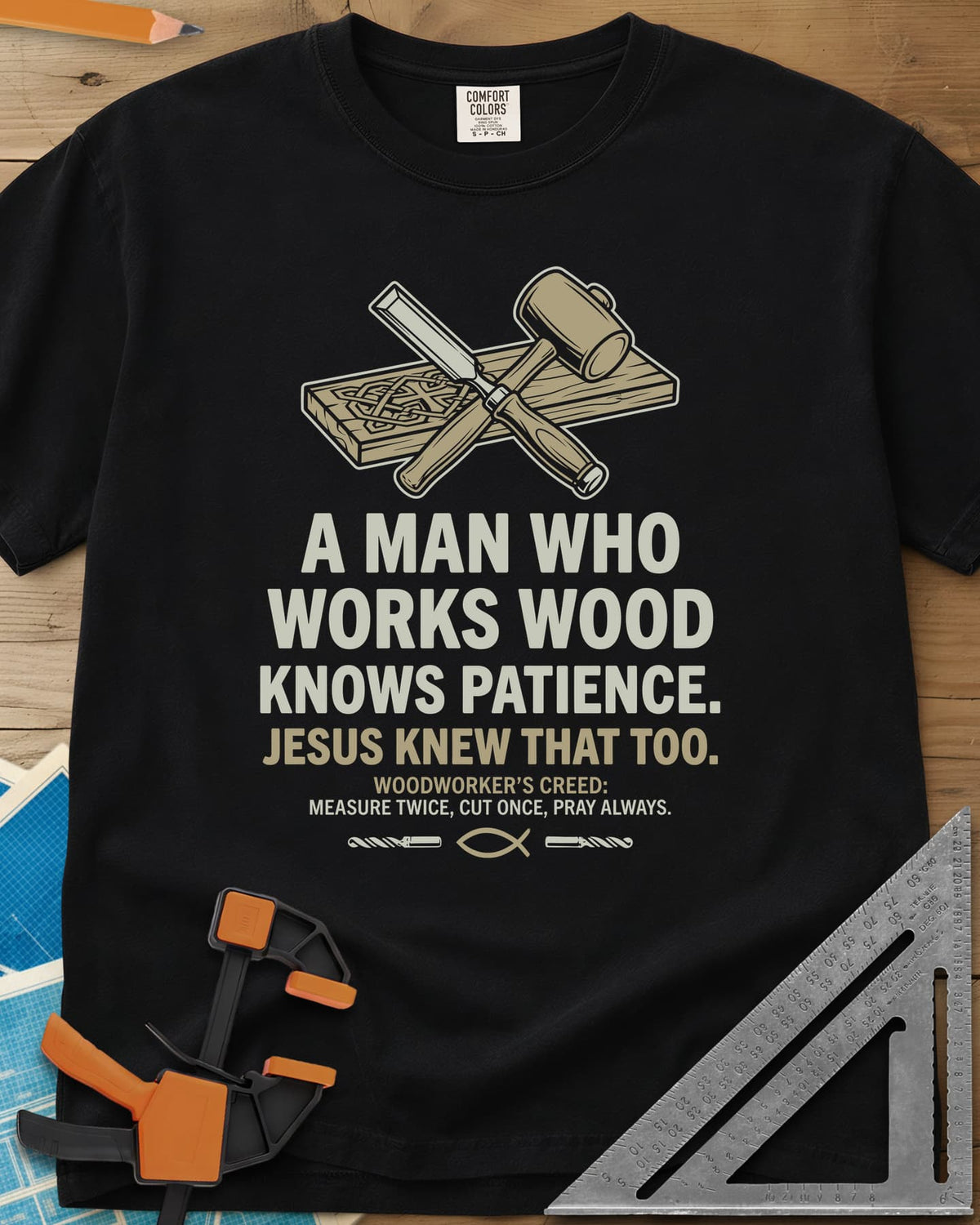 Works Wood Knows Patience heavyweight tee in Black, a chisel and mallet crossed over a carved board, a small fish symbol