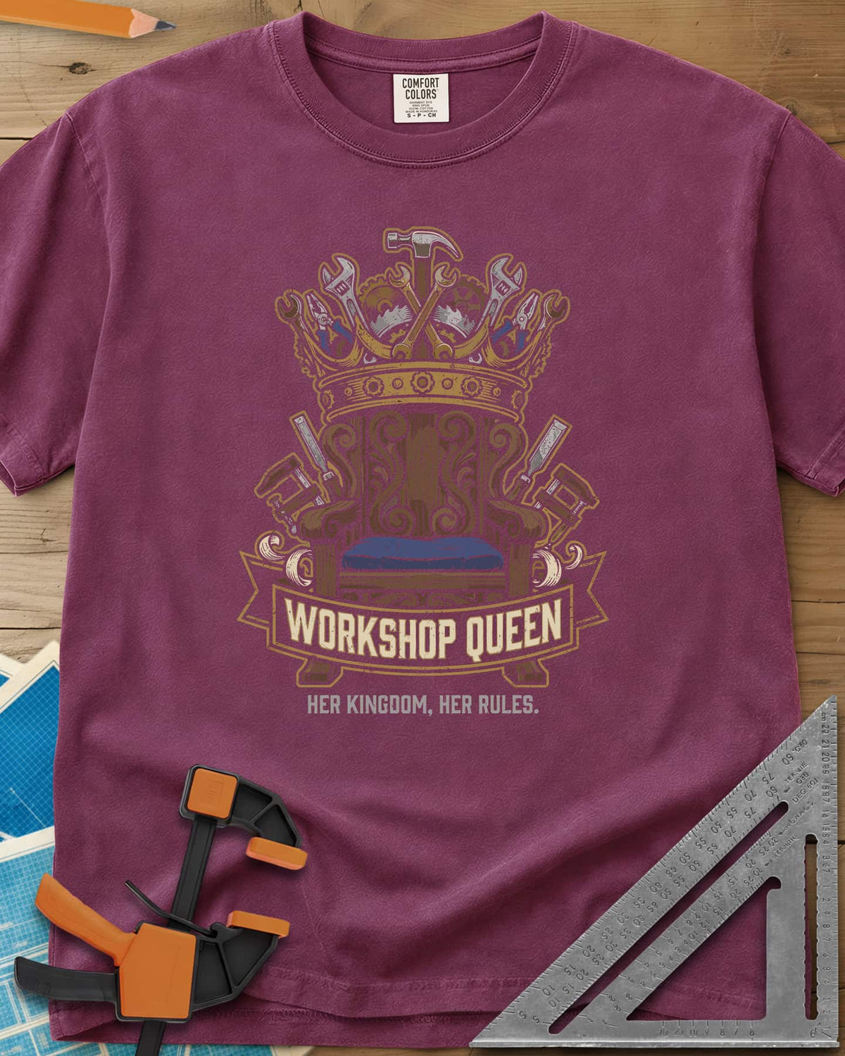 Workshop Queen heavyweight tee in Berry, a carved wooden throne under a crown made of tools