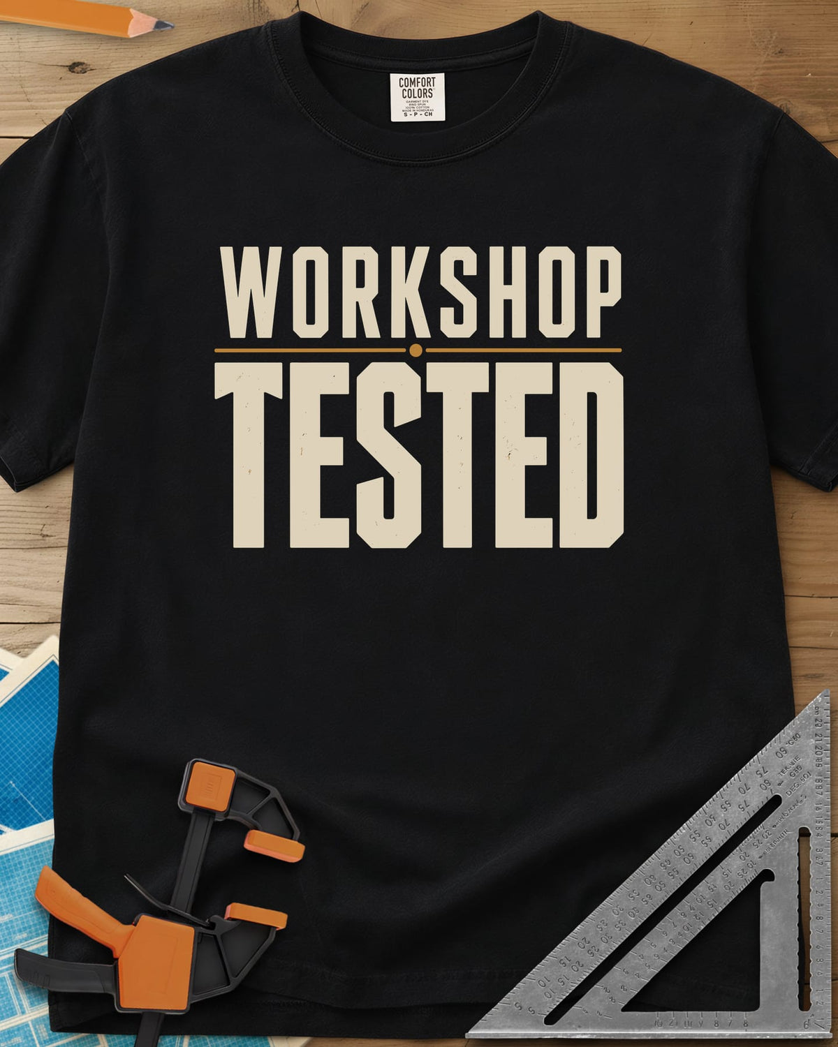 Workshop Tested heavyweight tee in Black, bold block lettering with a thin gold rule, no graphics