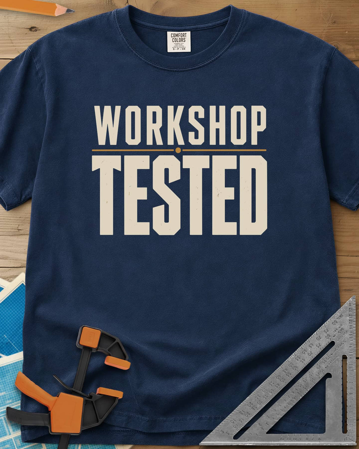 Workshop Tested heavyweight tee in Navy, bold block lettering with a thin gold rule, no graphics