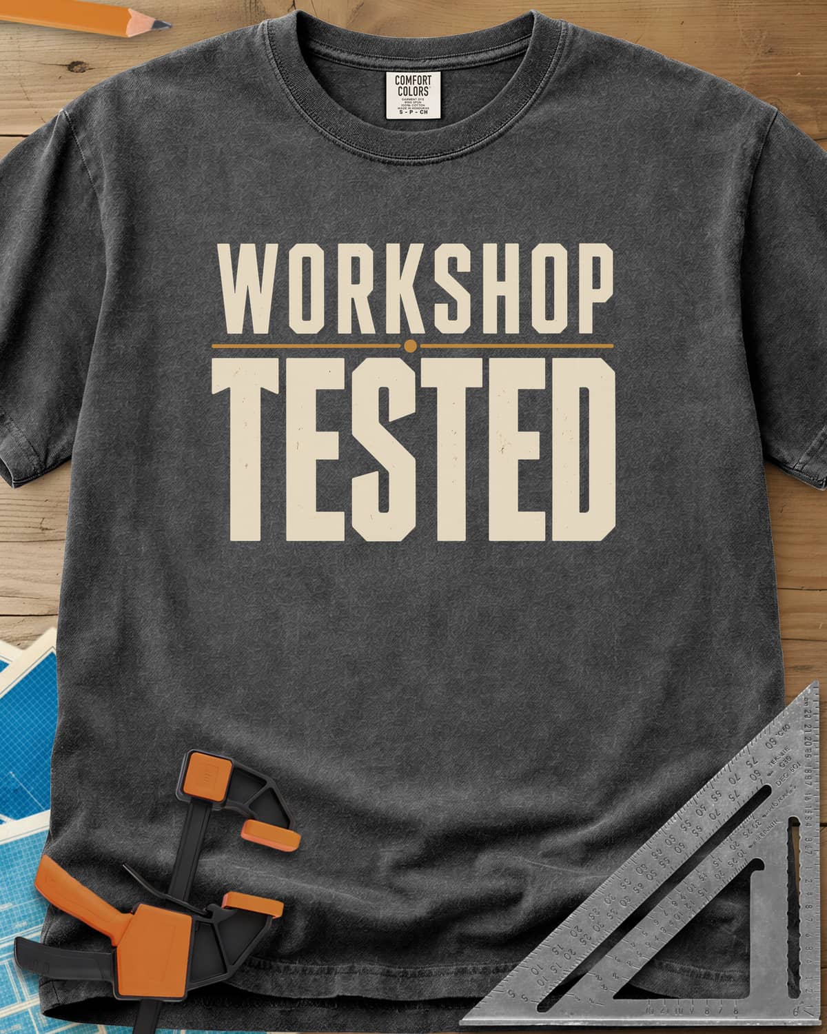 Workshop Tested heavyweight tee in Pepper, bold block lettering with a thin gold rule, no graphics