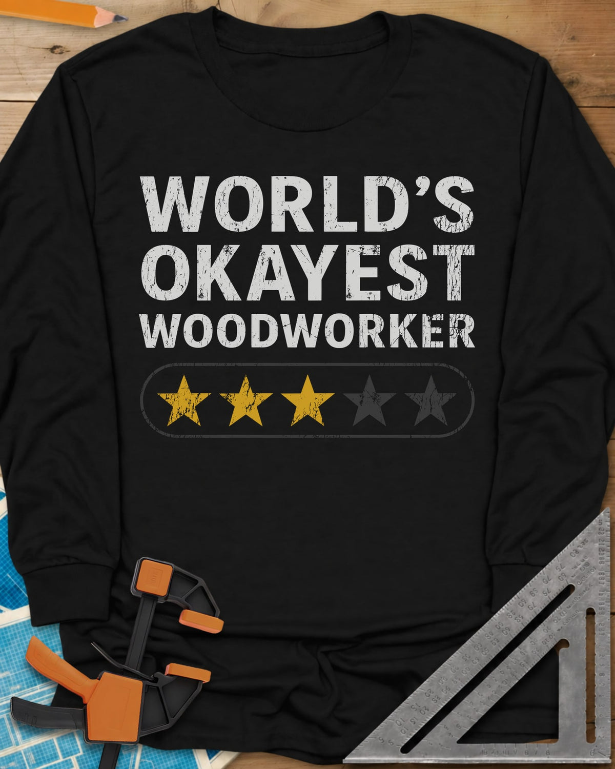 World’s Okayest Woodworker long sleeve shirt in Black, block letters above a five-star bar with three stars filled