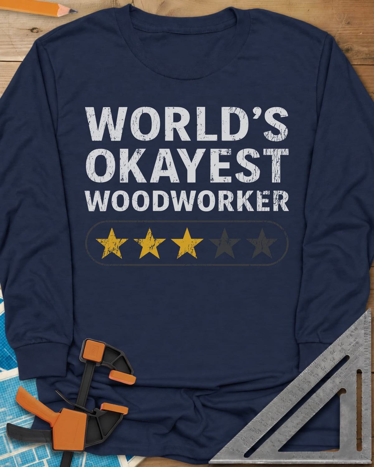 World’s Okayest Woodworker long sleeve shirt in Navy, block letters above a five-star bar with three stars filled