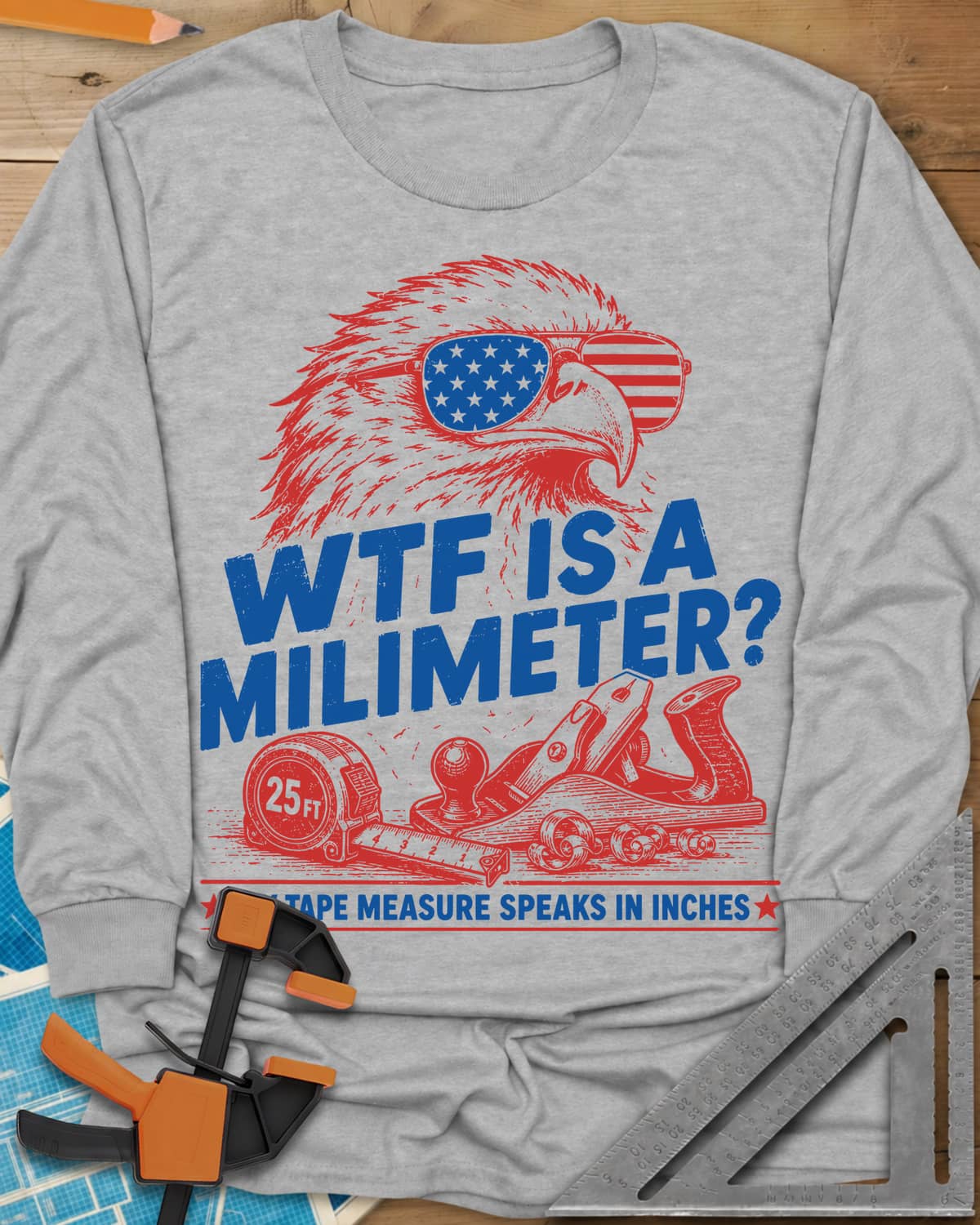 WTF Is A Millimeter long sleeve shirt in Sport Grey, an eagle in flag sunglasses above a hand plane and 25 ft tape
