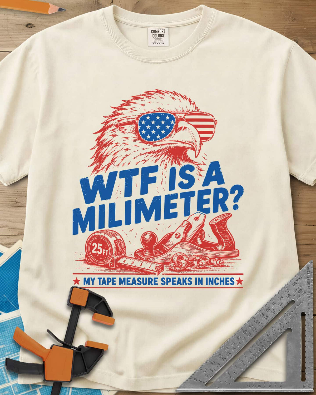 WTF Is A Millimeter heavyweight tee in Ivory, an eagle in flag sunglasses above a hand plane and 25 ft tape