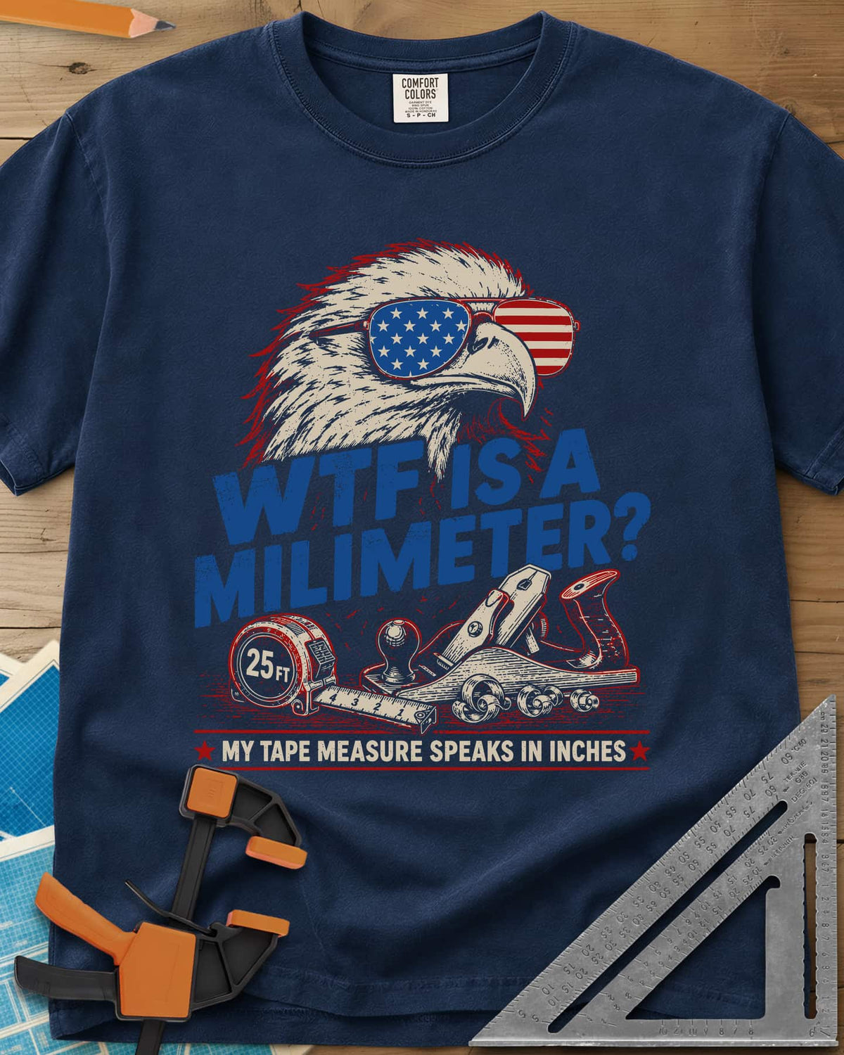 WTF Is A Millimeter heavyweight tee in Navy, an eagle in flag sunglasses above a hand plane and 25 ft tape