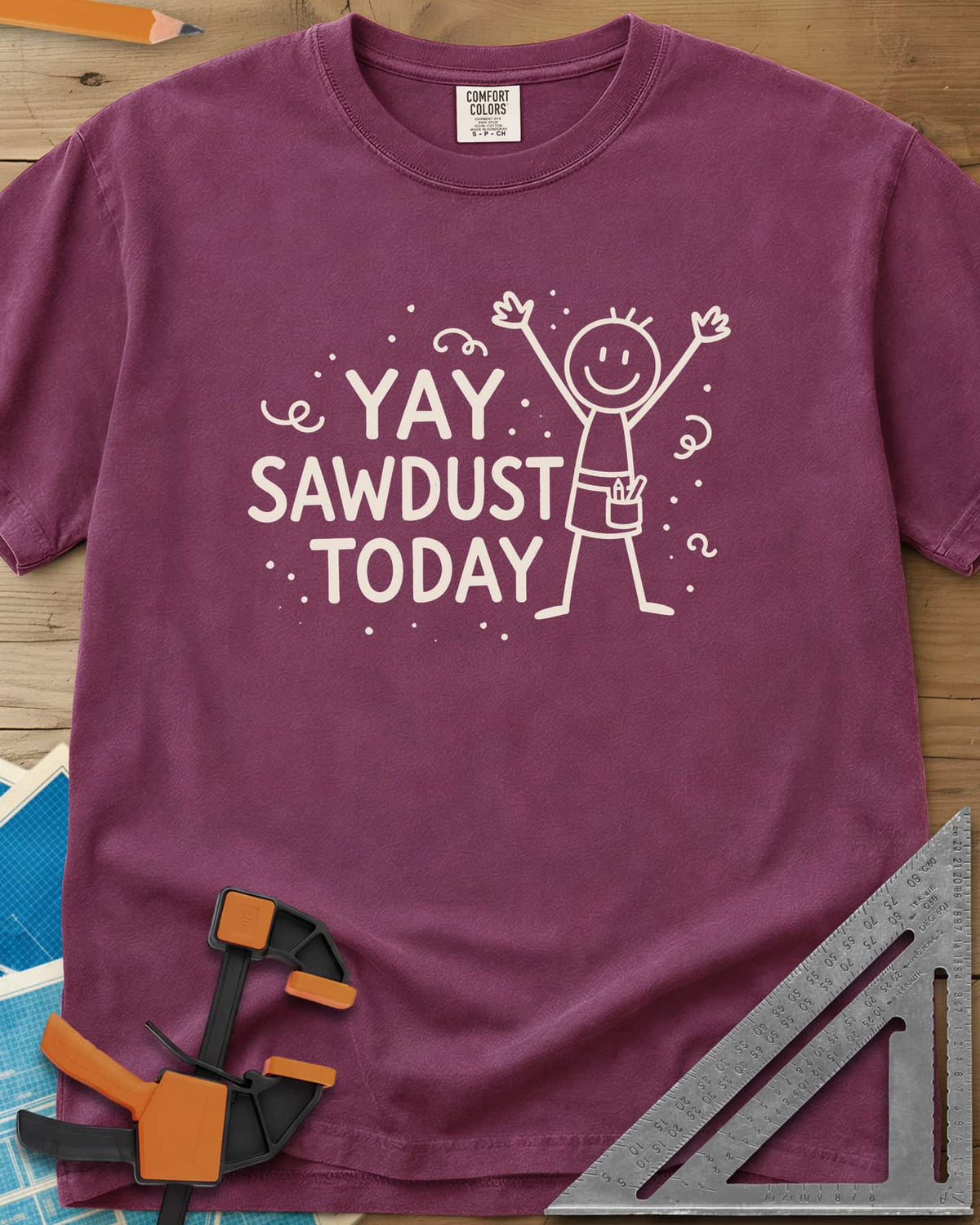 Yay Sawdust Today heavyweight tee in Berry, a cheering stick figure with a pencil-filled tool pouch