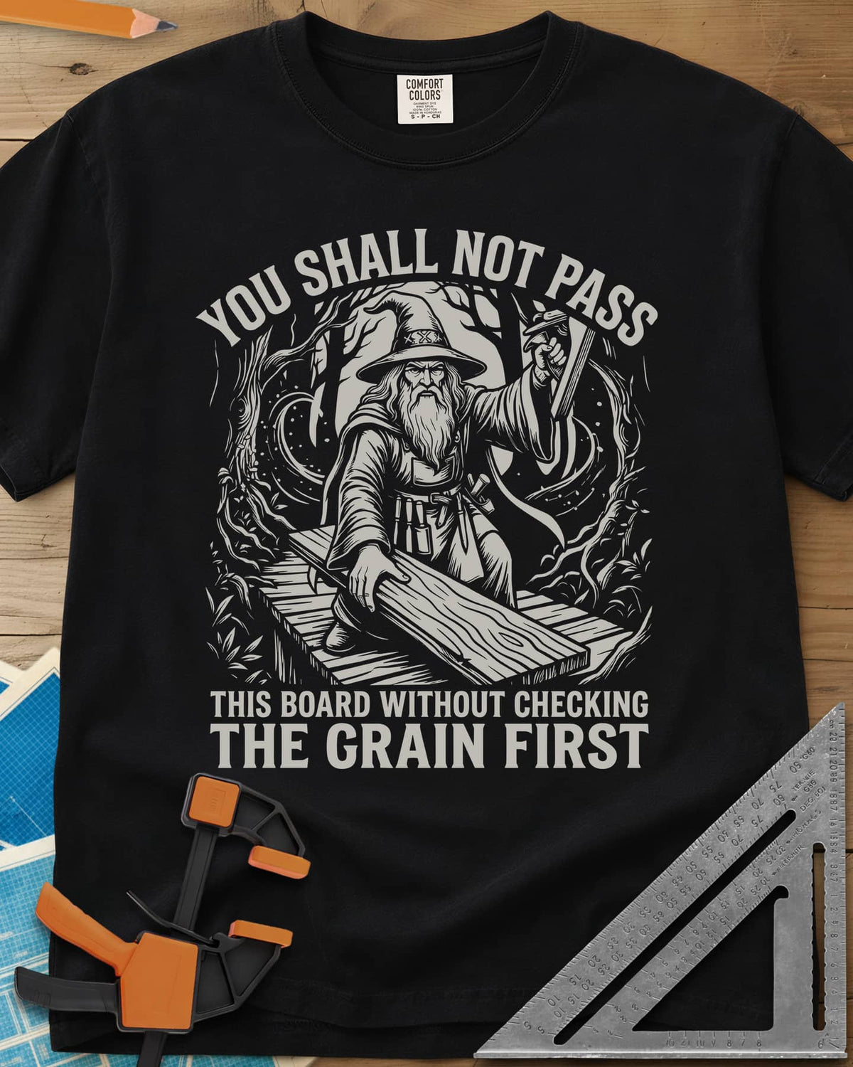 You Shall Not Pass Grain Check Woodworking heavyweight tee in Black, a bearded wizard in a pointed hat blocking a plank