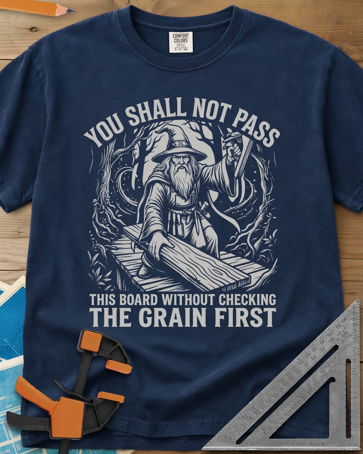 You Shall Not Pass Grain Check Woodworking heavyweight tee in Navy, a bearded wizard in a pointed hat blocking a plank bridge