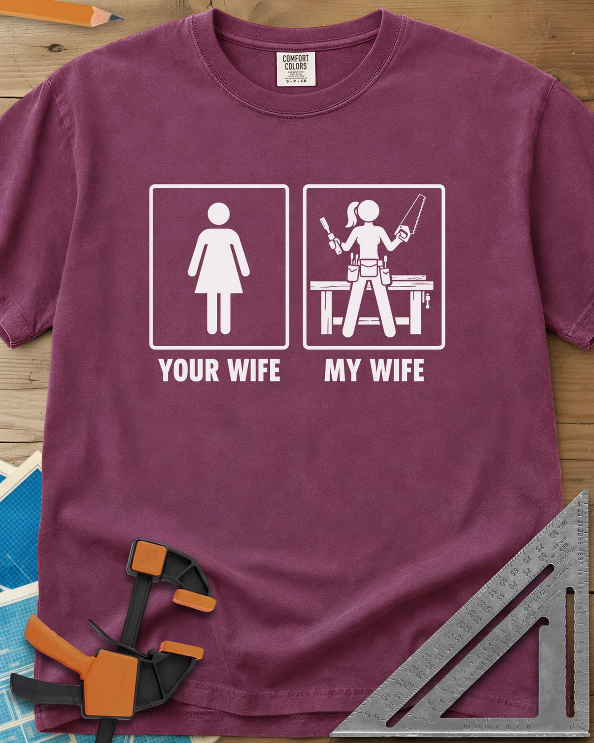 Your Wife My Wife heavyweight tee in Berry, two framed icons, a plain figure and a woman with saw and chisel