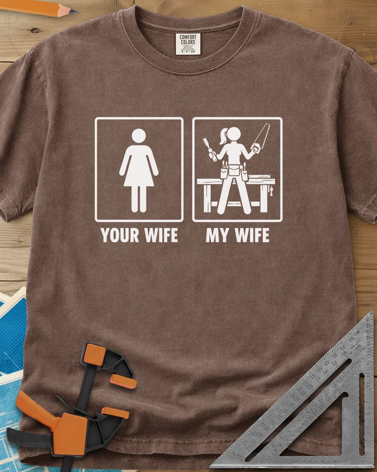 Your Wife My Wife heavyweight tee in Espresso, two framed icons, a plain figure and a woman with saw and chisel