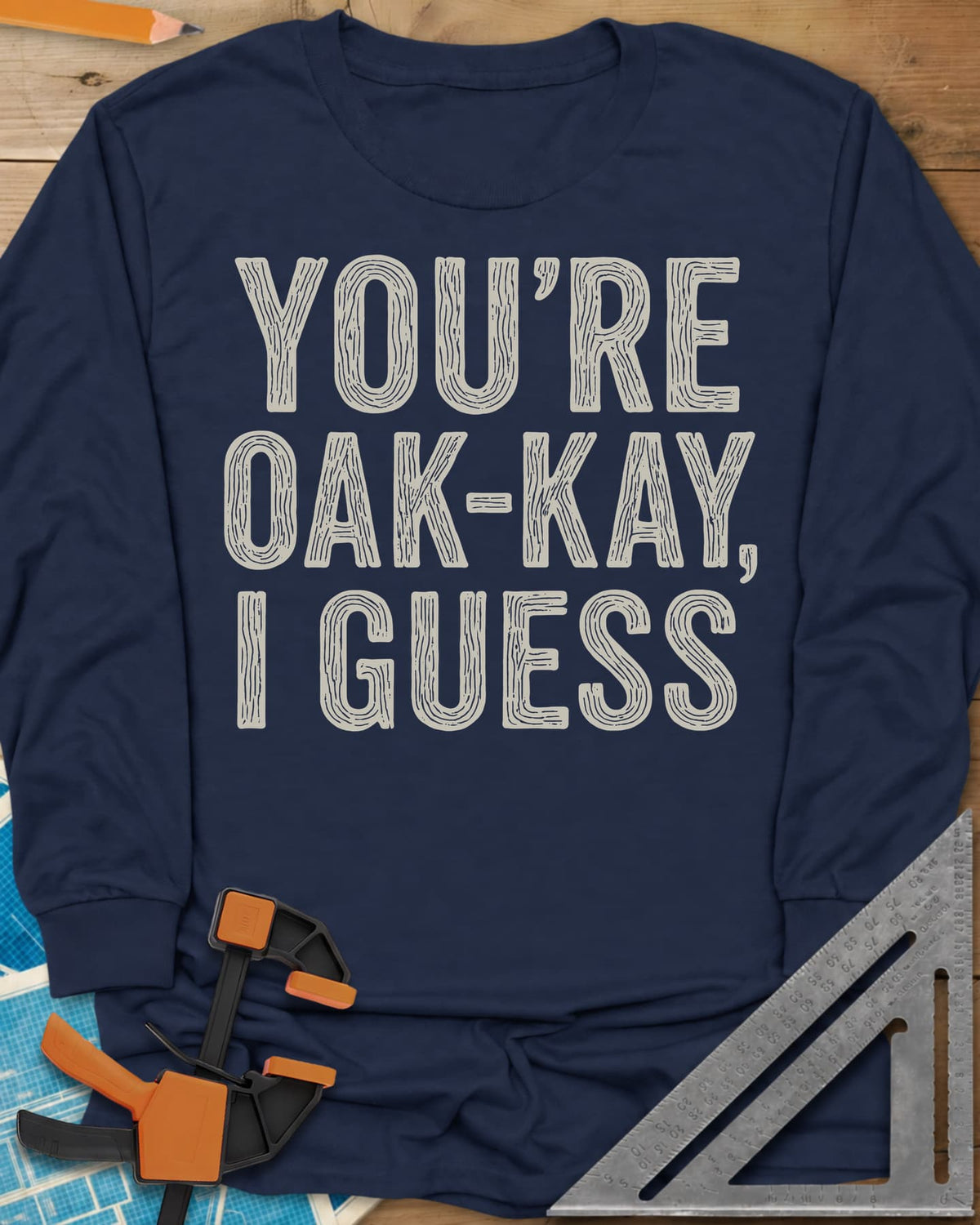 You're Oak-Kay long sleeve shirt in Navy, tall block letters filled with wood-grain lines