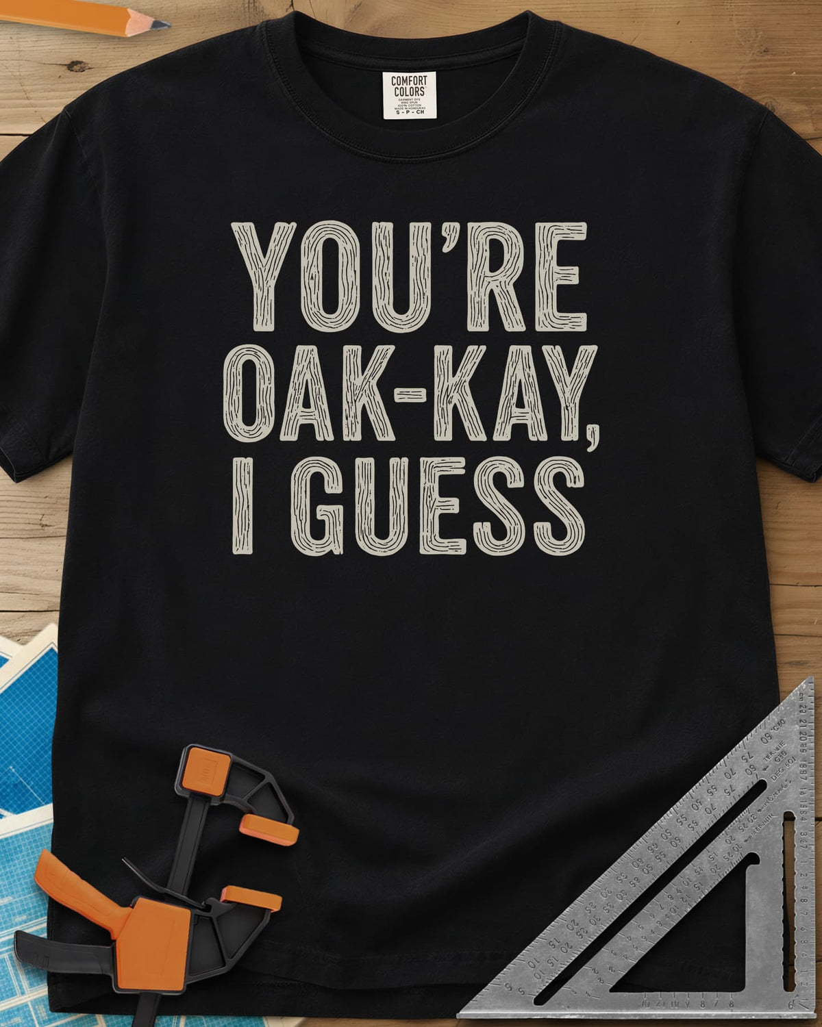 You're Oak-Kay heavyweight tee in Black, tall block letters filled with wood-grain lines