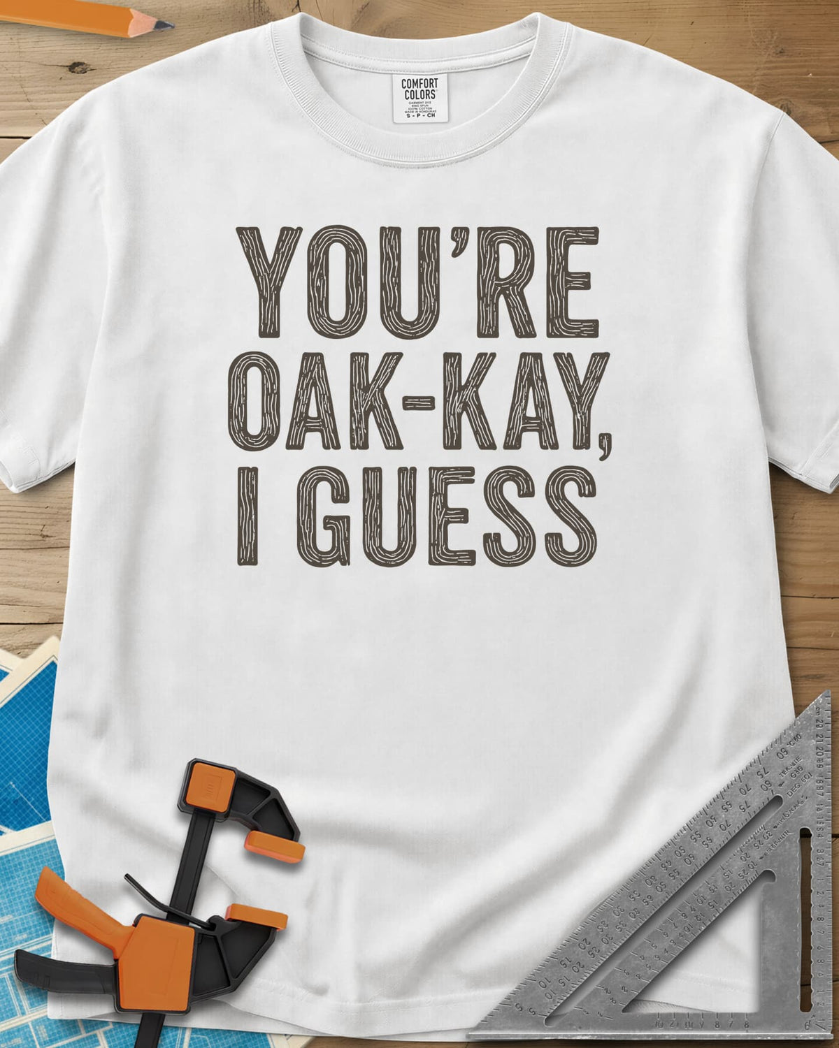 You're Oak-Kay heavyweight tee in White, tall block letters filled with wood-grain lines