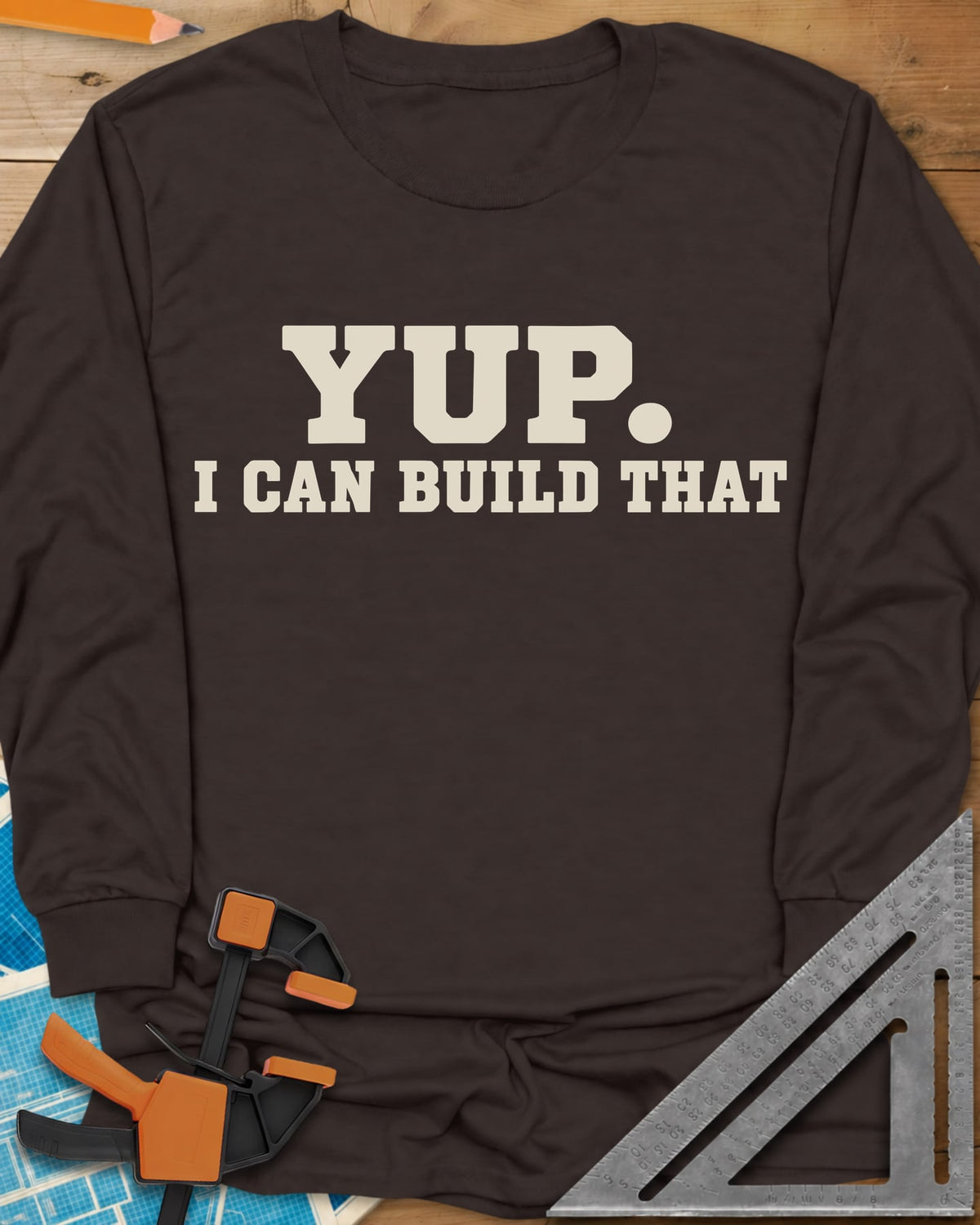 Yup Build That long sleeve shirt in Dark Chocolate, bold slab lettering only, with a big round period after YUP