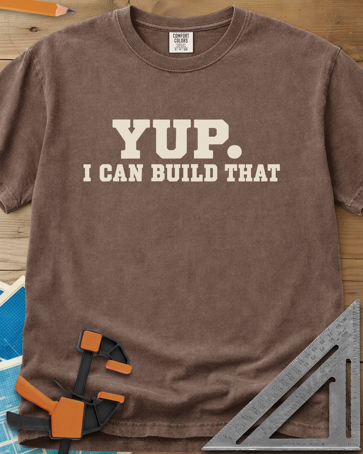 Yup Build That heavyweight tee in Espresso, bold slab lettering only, with a big round period after YUP