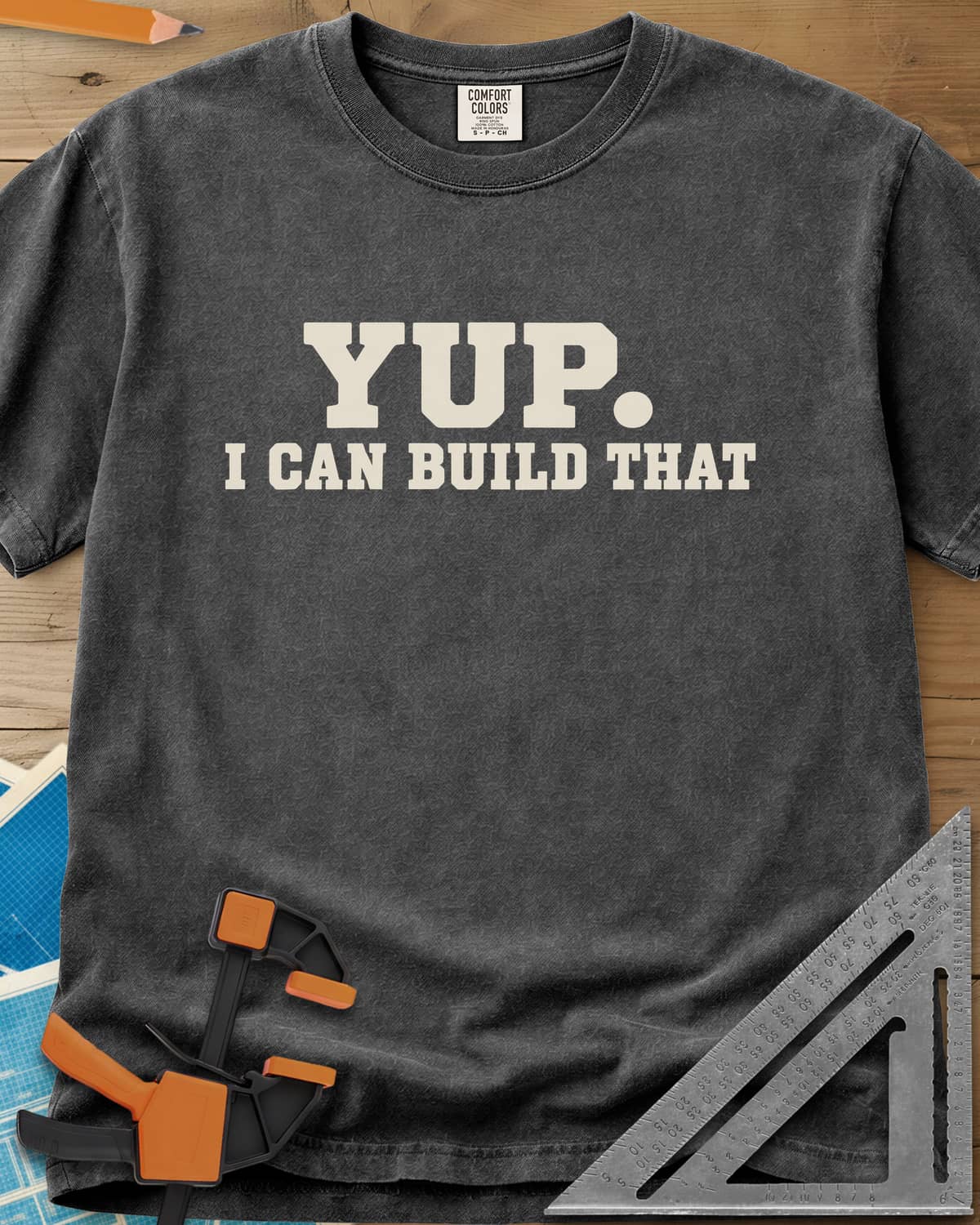 Yup Build That heavyweight tee in Pepper, bold slab lettering only, with a big round period after YUP